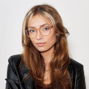 Headshot of Emelie Olsson in black dress wearing spectacles