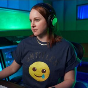 A woman in a t shirt wearing a headset